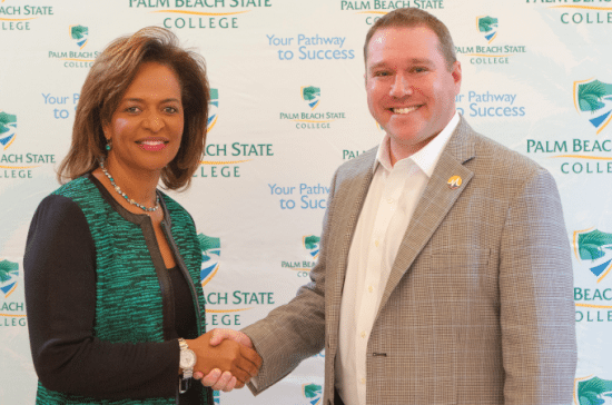 PBSC President Ava L. Parker, J.D., and Dan Cane, CEO and co-founder of Modernizing Medicine, shake hands on the memorandum of understanding.