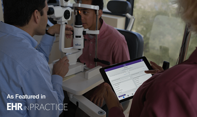 ophthalmologist performing an exam and assistant looking at an EHR on an iPad