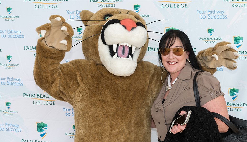 Palm Beach State College Panther mascot with Susan Mack, a Modernizing Medicine employee Palm Beach State College Panther mascot with Susan Mack, a Modernizing Medicine employee