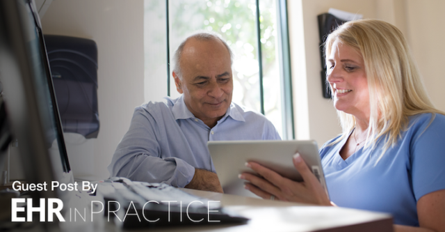 Medical Assistant and Staff member looking at an iPad EHR system