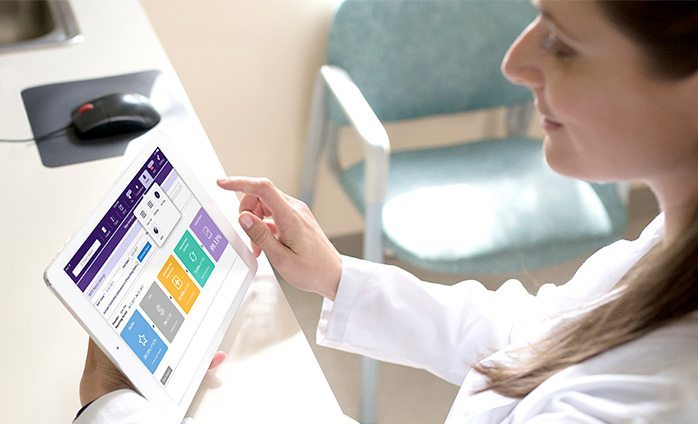 female doctor viewing MIPS scorecard on iPad