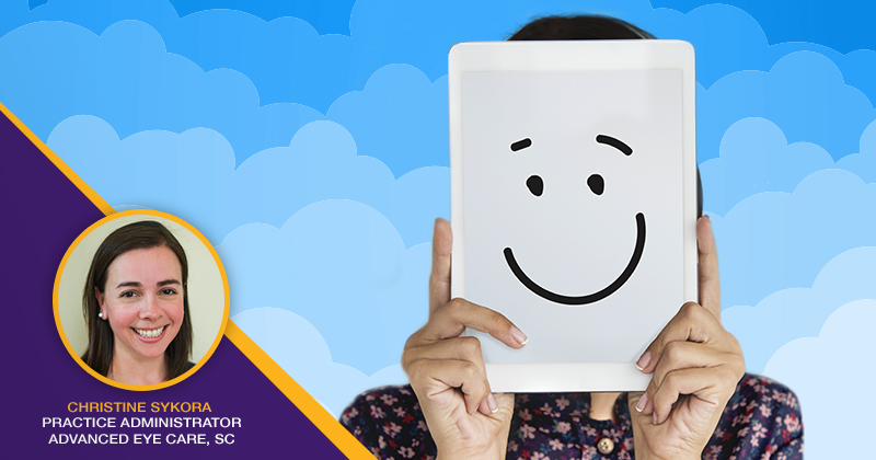 iPad with smiling face with illustrated clouds in the background