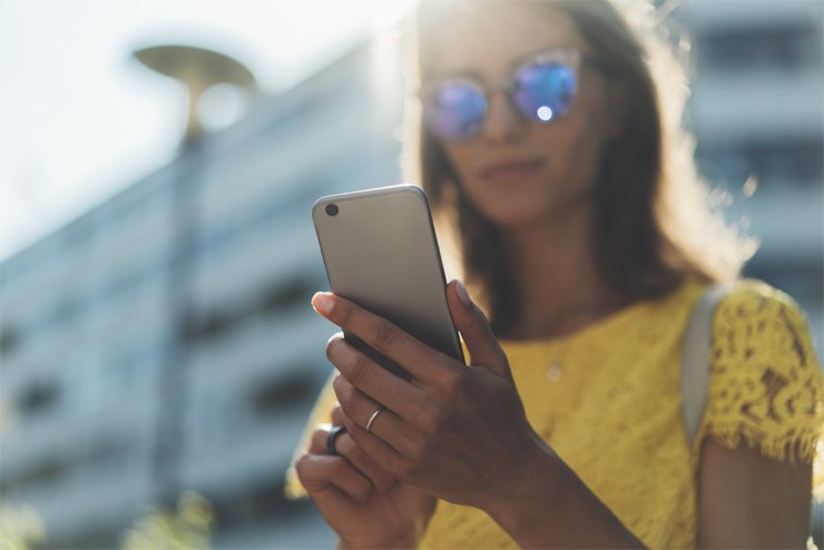 girl with sunglasses holding smartphone girl with sunglasses holding smartphone