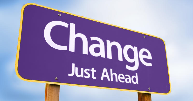 purple road sign with the words change ahead