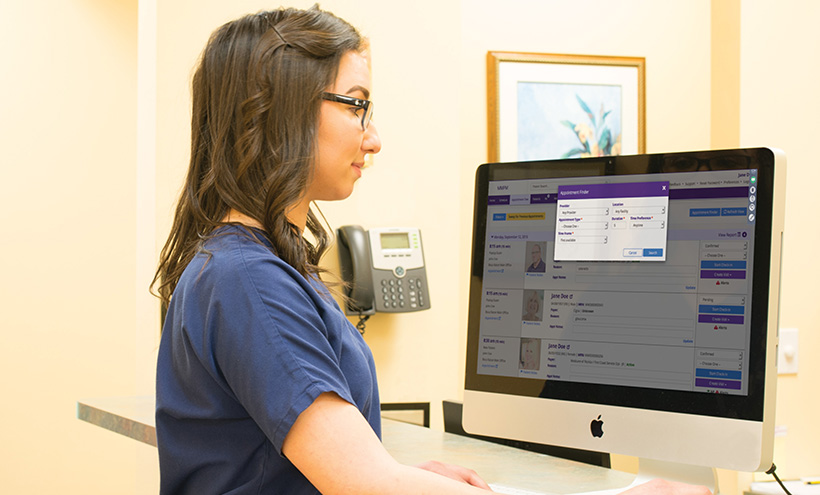 office staff using practice management and interacting with patients office staff using practice management and interacting with patients