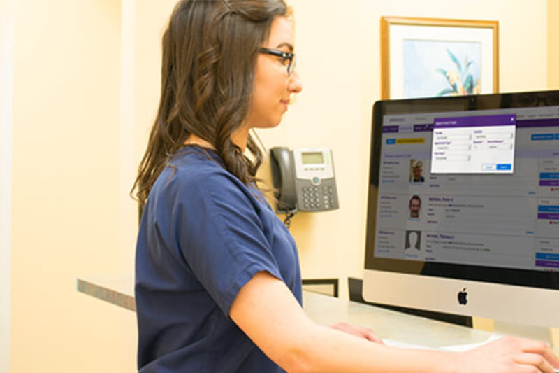 Practice Management software on a desktop Practice Management software on a desktop