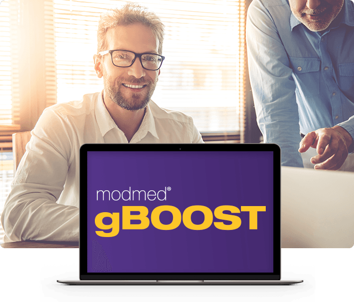 man with glasses smiling and a man pointing and laptop with gboost text man with glasses smiling and a man pointing and laptop with gboost text