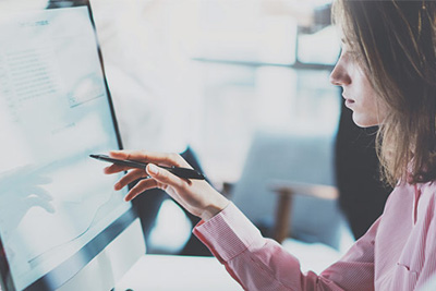 female on computer at home