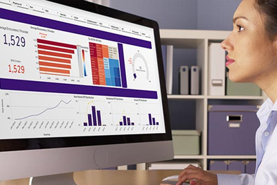 Office staff looking at analytics chart