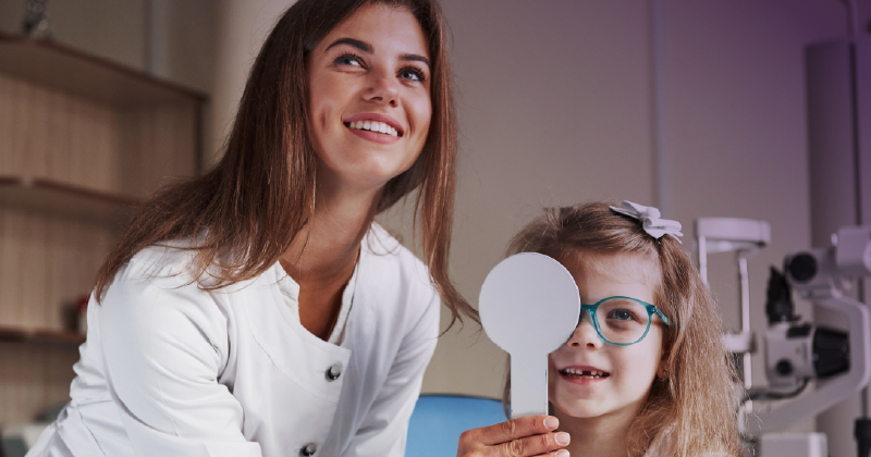 Physician with a young patient in an ophthalmology practice