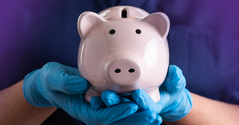 Gloved hands holding a piggy bank