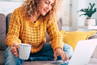 female on computer at home