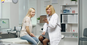 OBGYN and patient looking at ipad