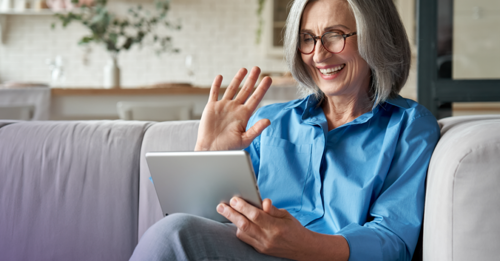 A woman communicates with her physician on her tablet.