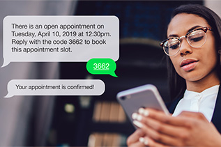 A woman schedules a doctor appointment with her mobile phone. A woman schedules a doctor appointment with her mobile phone.