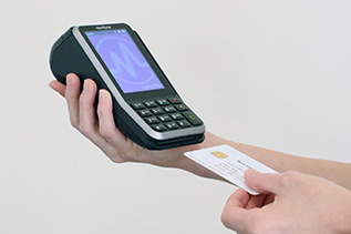 A patient makes a payment with their credit card. A patient makes a payment with their credit card.