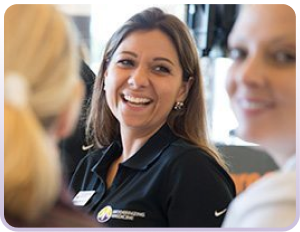 Photo of woman chatting with group