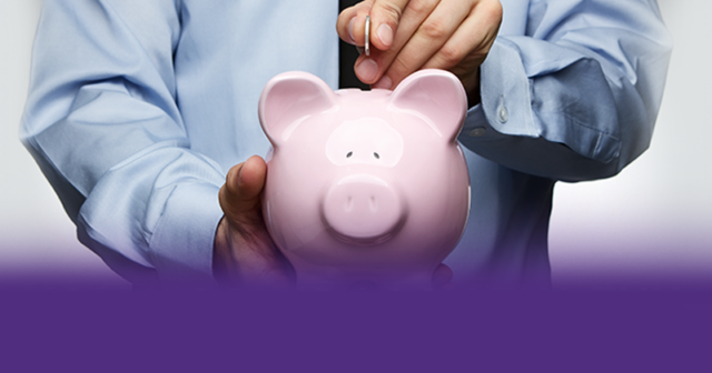 Doctor placing a coin in a piggy bank.