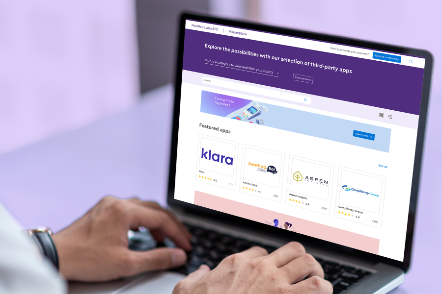 Image of physician recording notes in allergy-specific software on phone