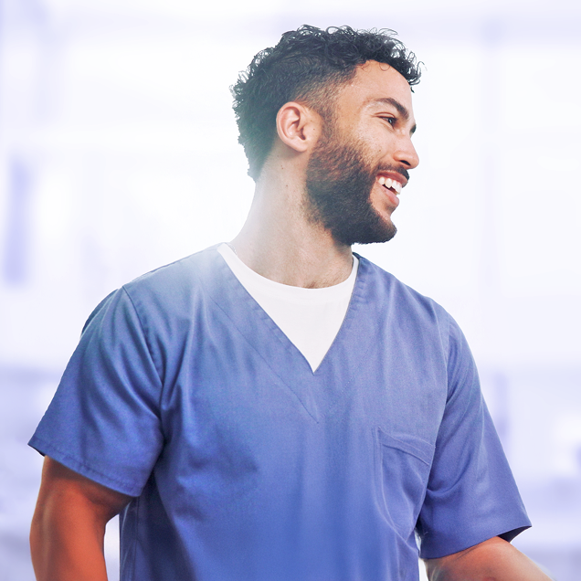 Smiling medical staff member using Ophthalmology EHR software in a clinical setting. Smiling medical staff member using Ophthalmology EHR software in a clinical setting.