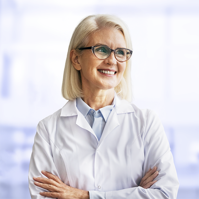 Smiling doctor in a clinical setting. Smiling doctor in a clinical setting.