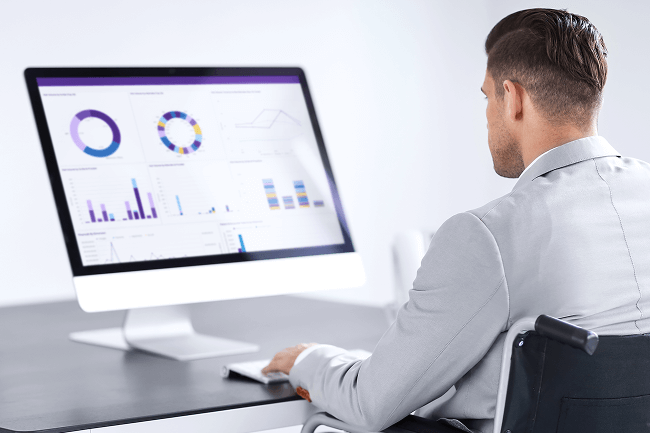 A practice administrator reviewing his practice’s clinical, operational and financial metrics with ModMed Analytics.