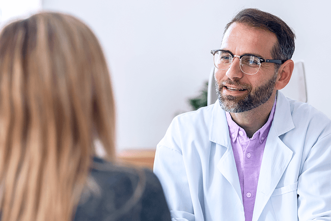 A gastroenterologist having a discussion with a patient.