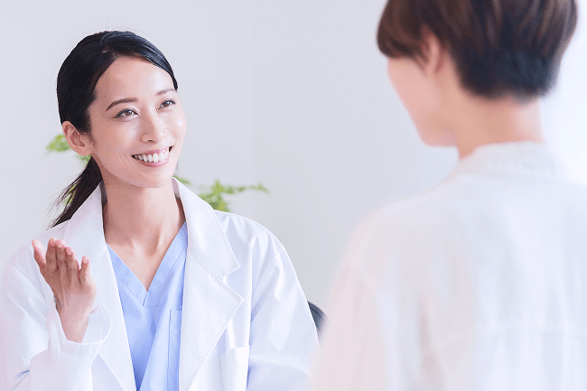 An OBGYN having a discussion with a patient.
