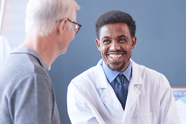 An ophthalmologist having a discussion with a patient.