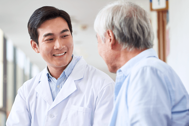 Urologist meeting with patient.