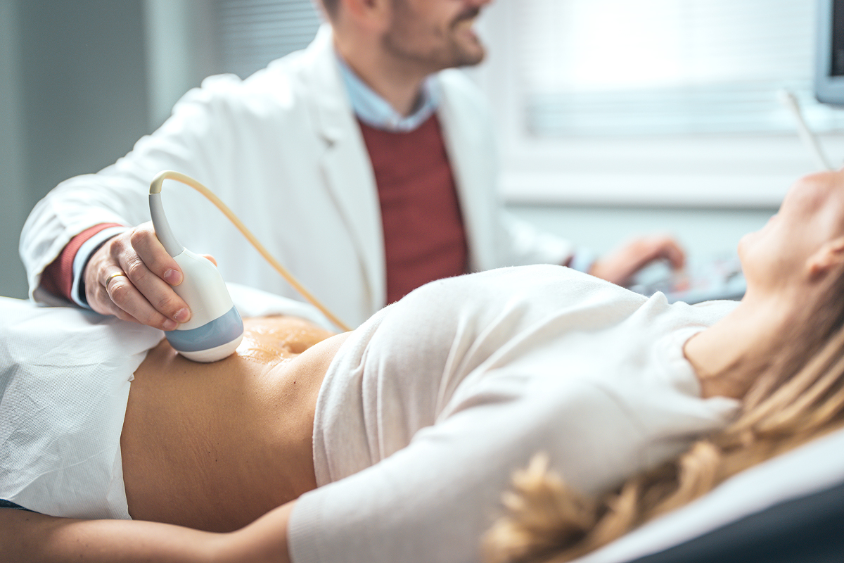 An OBGYN doing a patient’s ultrasound