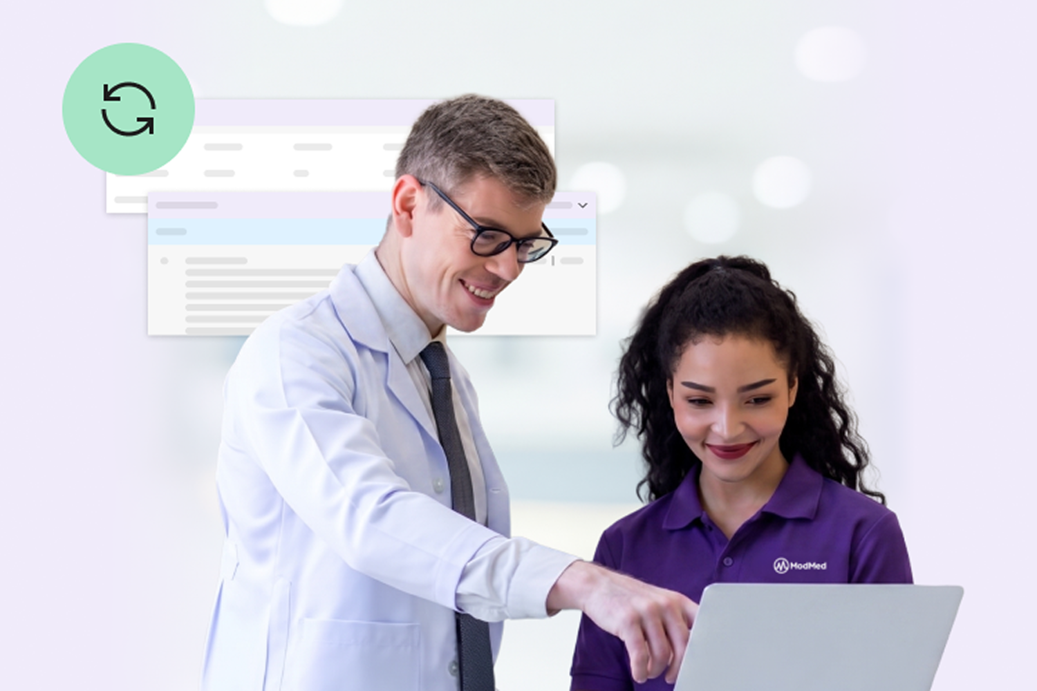 A smiling male healthcare professional in a white coat pointing at a laptop screen while collaborating with a smiling woman in a purple polo shirt, accompanied by floating abstract software interface windows and a green synchronization icon.