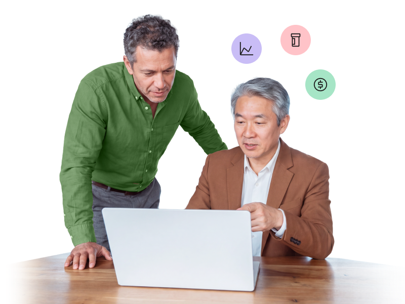 Two men collaborating and looking at a laptop screen, with floating icons of a line chart, a pill bottle, and a dollar sign above them.